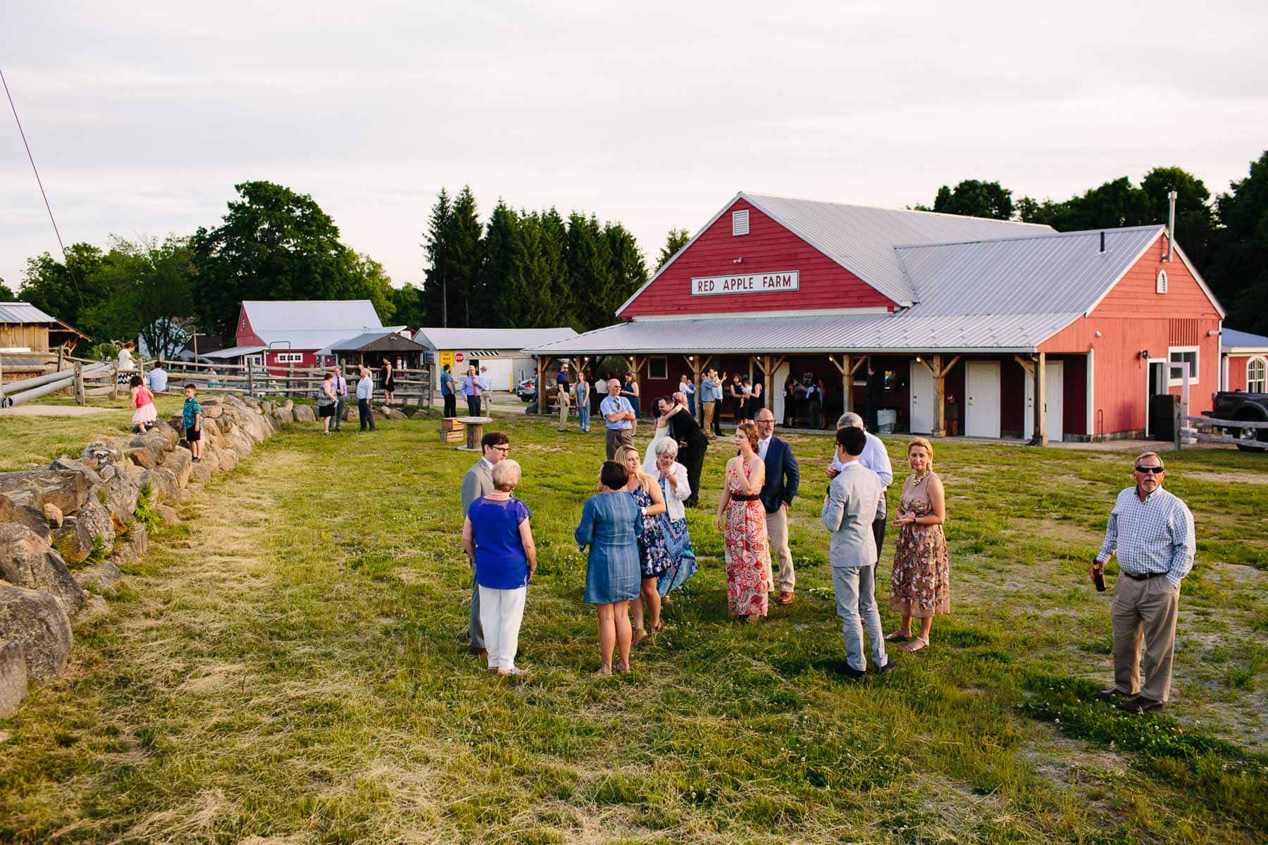 guests enjoy the evening air outside the barn at Red Apple Farm, Phillipston, MA