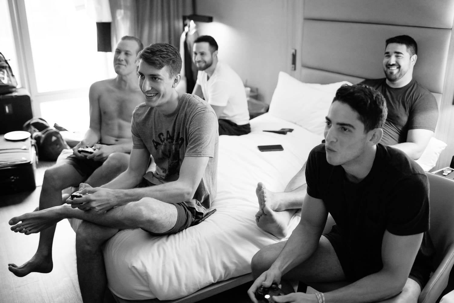 groom and groomsmen playing video games