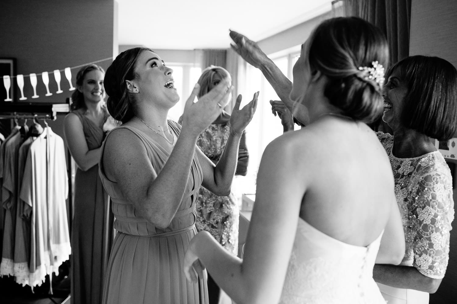 bridesmaid reacts to seeing bride in dress