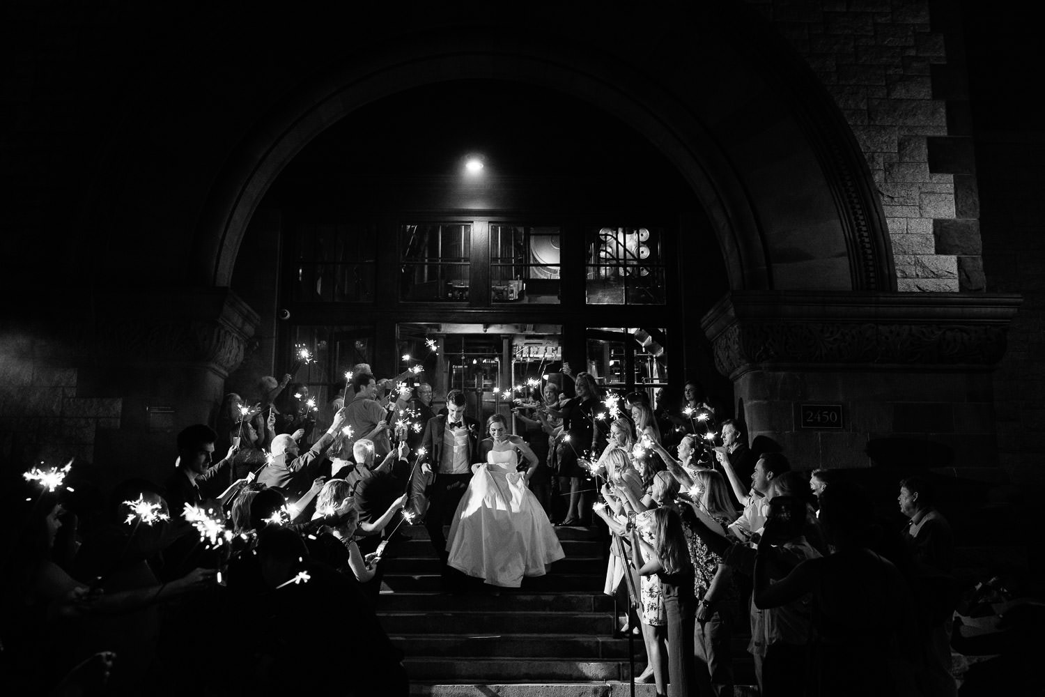 bride and groom make a sparkler exit from their waterworks museum wedding